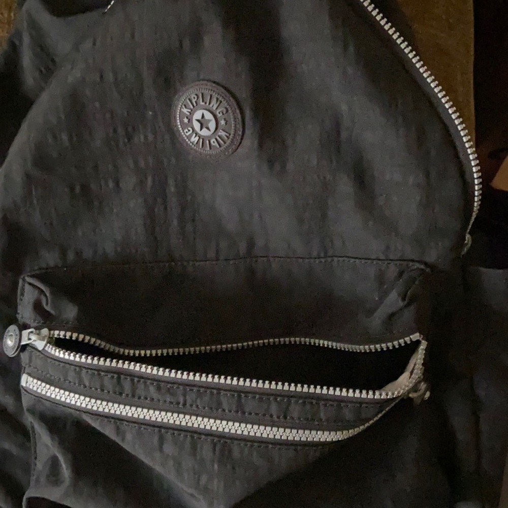 Kipling back pack basically new! Didn’t wear much